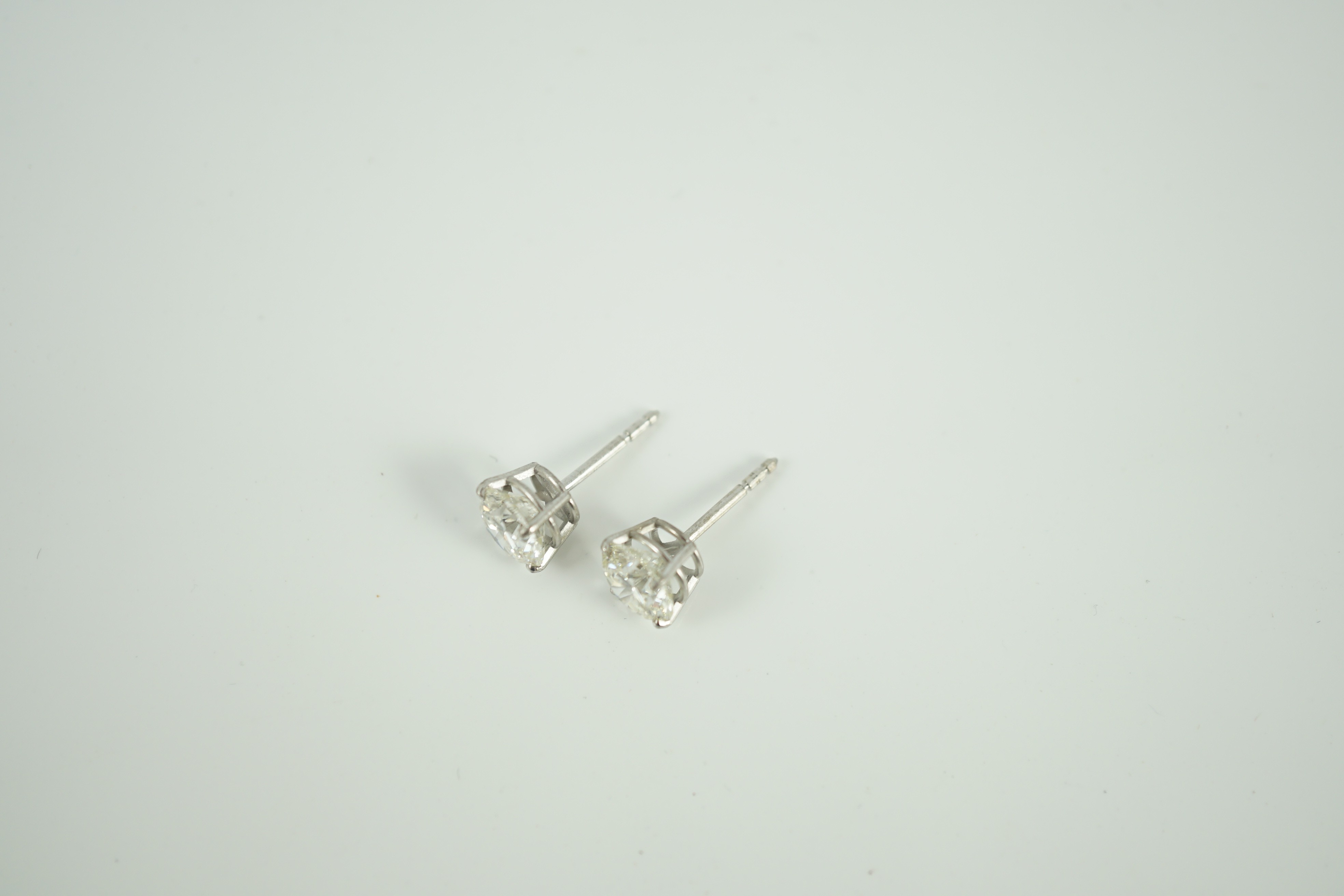 A pair of 750 white metal and solitaire diamond set ear studs, each stone weighing approximately 1.50ct